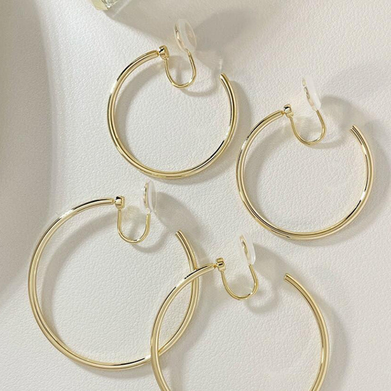 Round mosquito incense holder with large circular ear pendant